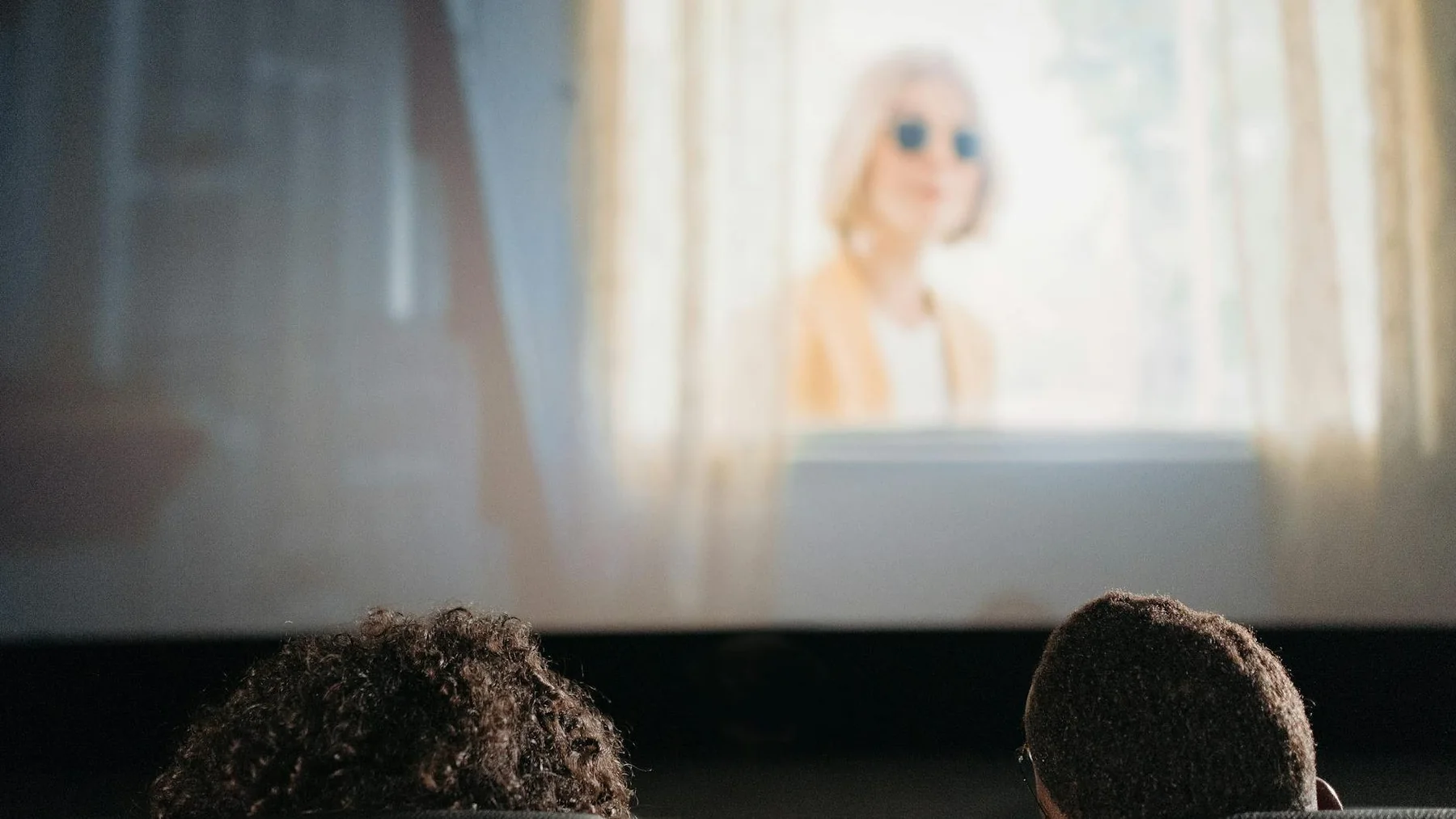 two people watching a movie