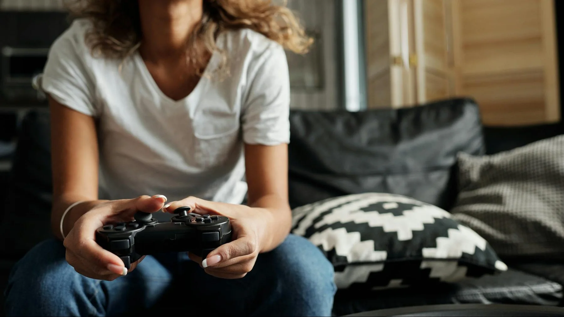 photo of woman using game controller